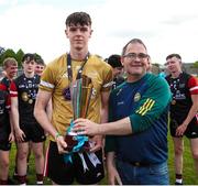 27 May 2023; East Cork captain Scott Molloy is presented with the trophy by Johnny Pilkington during the GAA Celtic Challenge Cup Finals match between East Cork and Dublin at St Brendan’s Park in Birr, Offaly. Photo by Michael P Ryan/Sportsfile