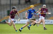 27 May 2023; Cormac Fitzpatrick of Tipperary in action against Ben O’Dwyer, left, and Owen Earls of Galway during the GAA Celtic Challenge Cup Finals match between Galway and Tipperary at St Brendan’s Park in Birr, Offaly. Photo by Michael P Ryan/Sportsfile