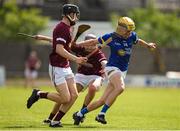 27 May 2023; Cormac Fitzpatrick of Tipperary in action against Rhys Creaven, left, and Cathal Sweeney of Galway during the GAA Celtic Challenge Cup Finals match between Galway and Tipperary at St Brendan’s Park in Birr, Offaly. Photo by Michael P Ryan/Sportsfile