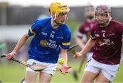 27 May 2023; Cormac Fitzpatrick of Tipperary in action against Cathal Sweeney of Galway during the GAA Celtic Challenge Cup Finals match between Galway and Tipperary at St Brendan’s Park in Birr, Offaly. Photo by Michael P Ryan/Sportsfile