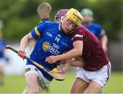 27 May 2023; Cormac Fitzpatrick of Tipperary in action against Cathal Sweeney of Galway during the GAA Celtic Challenge Cup Finals match between Galway and Tipperary at St Brendan’s Park in Birr, Offaly. Photo by Michael P Ryan/Sportsfile