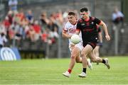 27 May 2023; Craig Lennon of Louth in action against Sean Powter of Cork during the GAA Football All-Ireland Senior Championship Round 1 match between Louth and Cork at Páirc Tailteann in Navan, Meath. Photo by Seb Daly/Sportsfile