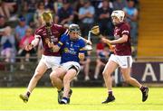 27 May 2023; Billy Collins of Tipperary in action against Ethan O’Brien, left, and Owen Earls of Galway during the GAA Celtic Challenge Cup Finals match between Galway and Tipperary at St Brendan’s Park in Birr, Offaly. Photo by Michael P Ryan/Sportsfile *** NO REPRODUCTION FEE***