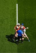 27 May 2023; James Doyle of Carlow, left, and teammate Fiachra Fitzpatrick, contest the throw in against Jack Clancy of Offaly, centre, and Sam Bourke during the Joe McDonagh Cup Final match between Carlow and Offaly at Croke Park in Dublin. Photo by Tyler Miller/Sportsfile