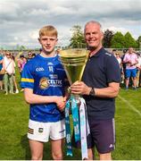 27 May 2023; Ken Hogan presents the trophy to Tipperary captain Bobby Power after the GAA Celtic Challenge Cup Finals match between Galway and Tipperary at St Brendan’s Park in Birr, Offaly. Photo by Michael P Ryan/Sportsfile