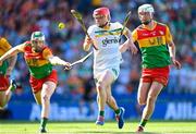 27 May 2023; Eoghan Cahill of Offaly in action against Paul Doyle, left, and Kevin McDonald of Carlow during the Joe McDonagh Cup Final match between Carlow and Offaly at Croke Park in Dublin. Photo by Stephen Marken/Sportsfile