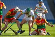 27 May 2023; David King of Offaly battles for possession against Chris Nolan of Carlow, left, and Martin Kavanagh during the Joe McDonagh Cup Final match between Carlow and Offaly at Croke Park in Dublin. Photo by Tyler Miller/Sportsfile