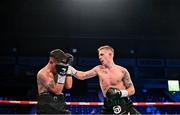 27 May 2023; Kurt Walker, right, in action against Maicol Velazco during their featherweight bout at the SSE Arena in Belfast. Photo by Ramsey Cardy/Sportsfile
