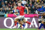 27 May 2023; Jack Crowley of Munster makes a break during the United Rugby Championship Final match between DHL Stormers and Munster at DHL Stadium in Cape Town, South Africa. Photo by Nic Bothma/Sportsfile