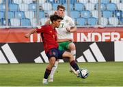 27 May 2023; Luke Kehir of Republic of Ireland in action against Daniel Munoz Navas of Spain during the UEFA European U17 Championship Quarter-Final match between Spain and Republic of Ireland at Hidegkuti Hándor Stadium in Budapest, Hungary. Photo by Laszlo Szirtesi/Sportsfile