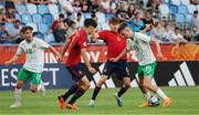 27 May 2023; Mason Melia of Republic of Ireland in action against Jon Martín Vicente and Pau Prim Coma of Spain during the UEFA European U17 Championship Quarter-Final match between Spain and Republic of Ireland at Hidegkuti Hándor Stadium in Budapest, Hungary. Photo by Laszlo Szirtesi/Sportsfile