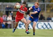 27 May 2023; Shane McGuigan of Derry in action against Ryan O'Toole of Monaghan during the GAA Football All-Ireland Senior Championship Round 1 match between Derry and Monaghan at Celtic Park in Derry. Photo by Harry Murphy/Sportsfile