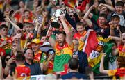 27 May 2023; Carlow captain Paul Doyle lifts the trophy after the Joe McDonagh Cup Final match between Carlow and Offaly at Croke Park in Dublin. Photo by Stephen Marken/Sportsfile