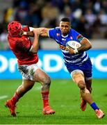 27 May 2023; Leolin Zas of DHL Stormers is tackled by John Hodnett of Munster  during the United Rugby Championship Final match between DHL Stormers and Munster at DHL Stadium in Cape Town, South Africa. Photo by Ashley Vlotman/Sportsfile