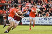 27 May 2023; Jarly Óg Burns of Armagh lays the ball off to Rory Grugan during the GAA Football All-Ireland Senior Championship Round 1 match between Armagh and Westmeath at the BOX-IT Athletic Grounds in Armagh. Photo by Oliver McVeigh/Sportsfile