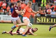 27 May 2023; Rian O'Neill of Armagh shooting for goal despite the tackle of James Dolan of Westmeath during the GAA Football All-Ireland Senior Championship Round 1 match between Armagh and Westmeath at the BOX-IT Athletic Grounds in Armagh. Photo by Oliver McVeigh/Sportsfile