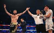 27 May 2023; Anthony Cacace is declared victorious over Damian Wrzesinski in their IBO World Super-Featherweight title bout at the SSE Arena in Belfast. Photo by Ramsey Cardy/Sportsfile