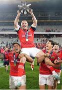 27 May 2023; Keith Earls of Munster is carried by teammates Malakai Fekitoa, left, and Antoine Frisch as they celebrate with the trophy afterthe United Rugby Championship Final match between DHL Stormers and Munster at DHL Stadium in Cape Town, South Africa. Photo by Nic Bothma/Sportsfile