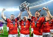 27 May 2023; Munster players, from left, Calvin Nash, Keith Earls and Shane Daly celebrate with the trophy after the United Rugby Championship Final match between DHL Stormers and Munster at DHL Stadium in Cape Town, South Africa. Photo by Ashley Vlotman/Sportsfile