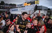 27 May 2023; Derry goalkeeper Odhran Lynch takes selfies with supporters after the GAA Football All-Ireland Senior Championship Round 1 match between Derry and Monaghan at Celtic Park in Derry. Photo by Harry Murphy/Sportsfile