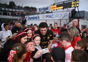 27 May 2023; Derry goalkeeper Odhran Lynch takes selfies with supporters after the GAA Football All-Ireland Senior Championship Round 1 match between Derry and Monaghan at Celtic Park in Derry. Photo by Harry Murphy/Sportsfile