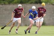 27 May 2023; Tom Delaney of Tipperary in action against Jake Keady, left, and Eoin Spellman of Galway during the GAA Celtic Challenge Cup Finals match between Galway and Tipperary at St Brendan’s Park in Birr, Offaly. Photo by Michael P Ryan/Sportsfile