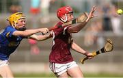 27 May 2023; Callum Keane of Galway in action against Charlie Ryan of Tipperary during the GAA Celtic Challenge Cup Finals match between Galway and Tipperary at St Brendan’s Park in Birr, Offaly. Photo by Michael P Ryan/Sportsfile *** NO REPRODUCTION FEE***