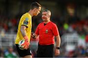 26 May 2023; Referee Sean Grant with Shamrock Rovers goalkeeper Leon Pohls during the SSE Airtricity Men's Premier Division match between Cork City and Shamrock Rovers at Turner's Cross in Cork. Photo by Eóin Noonan/Sportsfile