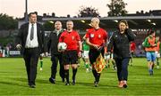 26 May 2023; Referee Sean Grant is escorted from the pitch by Cork City event controller Robbie Kelleher and head of security Carol O'Sulivan after the SSE Airtricity Men's Premier Division match between Cork City and Shamrock Rovers at Turner's Cross in Cork. Photo by Eóin Noonan/Sportsfile