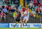 27 May 2023; Luke Fahy of Cork in action against Paul Mathews of Louth during the GAA Football All-Ireland Senior Championship Round 1 match between Louth and Cork at Páirc Tailteann in Navan, Meath. Photo by Seb Daly/Sportsfile