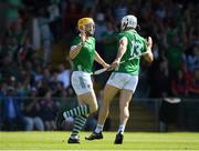 28 May 2023; Seamus Flanagan of Limerick, left, celebrates with teammate Aaron Gillane after scoring his side's first goal during the Munster GAA Hurling Senior Championship Round 5 match between Limerick and Cork at TUS Gaelic Grounds in Limerick. Photo by Daire Brennan/Sportsfile
