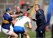 28 May 2023; Waterford manager Davy Fitzgerald tries to avoid the challenge of Alan Tynan of Tipperary and Jack Fagan of Waterford during the Munster GAA Hurling Senior Championship Round 5 match between Tipperary and Waterford at FBD Semple Stadium in Thurles, Tipperary. Photo by Michael P Ryan/Sportsfile