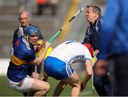 28 May 2023; Waterford manager Davy Fitzgerald tries to avoid the challenge of Alan Tynan of Tipperary and Jack Fagan of Waterford during the Munster GAA Hurling Senior Championship Round 5 match between Tipperary and Waterford at FBD Semple Stadium in Thurles, Tipperary. Photo by Michael P Ryan/Sportsfile