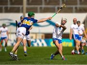 28 May 2023; Dessie Hutchinson of Waterford has his shot blocked by Brian McGrath of Tipperary during the Munster GAA Hurling Senior Championship Round 5 match between Tipperary and Waterford at FBD Semple Stadium in Thurles, Tipperary. Photo by Michael P Ryan/Sportsfile