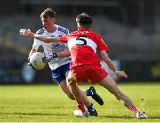 28 May 2023; Conor Meehan of Monaghan in action against Cahir Spiers of Derry during the Electric Ireland Ulster Minor GAA Football Championship Final match between Derry and Monaghan at Box-It Athletic Grounds in Armagh. Photo by Stephen Marken/Sportsfile