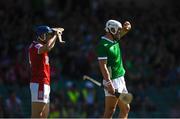28 May 2023; Aaron Gillane of Limerick and Sean O'Donoghue of Cork shield their eyes from the sun during the Munster GAA Hurling Senior Championship Round 5 match between Limerick and Cork at TUS Gaelic Grounds in Limerick. Photo by Daire Brennan/Sportsfile