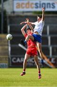 28 May 2023; James Sargent of Derry in action against Odhran Maher of Monaghan during the Electric Ireland Ulster Minor GAA Football Championship Final match between Derry and Monaghan at Box-It Athletic Grounds in Armagh. Photo by Stephen Marken/Sportsfile