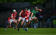 28 May 2023; Gearoid Hegarty of Limerick races clear of Cork players Robert Downey and Patrick Horgan, left, during the Munster GAA Hurling Senior Championship Round 5 match between Limerick and Cork at TUS Gaelic Grounds in Limerick. Photo by Ray McManus/Sportsfile