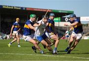 28 May 2023; Colin Dunford of Waterford in action against Tipperary players from left, Noel McGrath, Conor Bowe, and Alan Tynan during the Munster GAA Hurling Senior Championship Round 5 match between Tipperary and Waterford at FBD Semple Stadium in Thurles, Tipperary. Photo by Michael P Ryan/Sportsfile