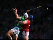 28 May 2023; Aaron Gillane of Limerick is tackled by Sean O'Donoghue of Cork, resulting in a penalty, during the Munster GAA Hurling Senior Championship Round 5 match between Limerick and Cork at TUS Gaelic Grounds in Limerick. Photo by Ray McManus/Sportsfile