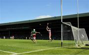 28 May 2023; Cork goalkeeper Patrick Collins prepares to stop the sliothar as Aaron Gillane  of Limerick is tackled by Sean O'Donoghue of Cork during the Munster GAA Hurling Senior Championship Round 5 match between Limerick and Cork at TUS Gaelic Grounds in Limerick. Photo by Ray McManus/Sportsfile