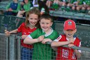 28 May 2023; Limerick and Cork cousins, Aoife Barrett, aged nine, Cian Brosnahan, aged eight, and Eoin Barrett, aged nine, before the Munster GAA Hurling Senior Championship Round 5 match between Limerick and Cork at TUS Gaelic Grounds in Limerick. Photo by Ray McManus/Sportsfile