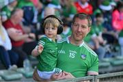 28 May 2023; Limerick supporters David Moloney and his son Oisín, aged three, before the Munster GAA Hurling Senior Championship Round 5 match between Limerick and Cork at TUS Gaelic Grounds in Limerick. Photo by Ray McManus/Sportsfile