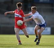 28 May 2023; Lee O'Neill of Derry in action against Max McGinnity of Monaghan during the Electric Ireland Ulster Minor GAA Football Championship Final match between Derry and Monaghan at Box-It Athletic Grounds in Armagh. Photo by Stephen Marken/Sportsfile