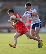 28 May 2023; Johnny McGuckian of Derry in action against Donnachadh Connolly of Monaghan during the Electric Ireland Ulster Minor GAA Football Championship Final match between Derry and Monaghan at Box-It Athletic Grounds in Armagh. Photo by Stephen Marken/Sportsfile