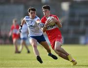 28 May 2023; Johnny McGuckian of Derry in action against Donnachadh Connolly of Monaghan during the Electric Ireland Ulster Minor GAA Football Championship Final match between Derry and Monaghan at Box-It Athletic Grounds in Armagh. Photo by Stephen Marken/Sportsfile