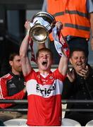 28 May 2023; Derry captain Fionn McEldowney lifts the cup after the Electric Ireland Ulster Minor GAA Football Championship Final match between Derry and Monaghan at Box-It Athletic Grounds in Armagh. Photo by Stephen Marken/Sportsfile