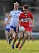 28 May 2023; Ger Dillon of Derry in action against Jamie McCaughey of Monaghan during the Electric Ireland Ulster Minor GAA Football Championship Final match between Derry and Monaghan at Box-It Athletic Grounds in Armagh. Photo by Stephen Marken/Sportsfile