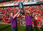 29 May 2023; Keith Earls, left, and Simon Zebo celebrate with the trophy during the Munster Rugby homecoming as URC Champions at Thomond Park in Limerick. Photo by David Fitzgerald/Sportsfile
