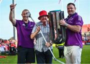 29 May 2023; Munster supporter Ivan O'Riordan celebrates with the trophy with Keith Earls, left, and Dave Kilcoyne during the Munster Rugby homecoming as URC Champions at Thomond Park in Limerick. Photo by David Fitzgerald/Sportsfile